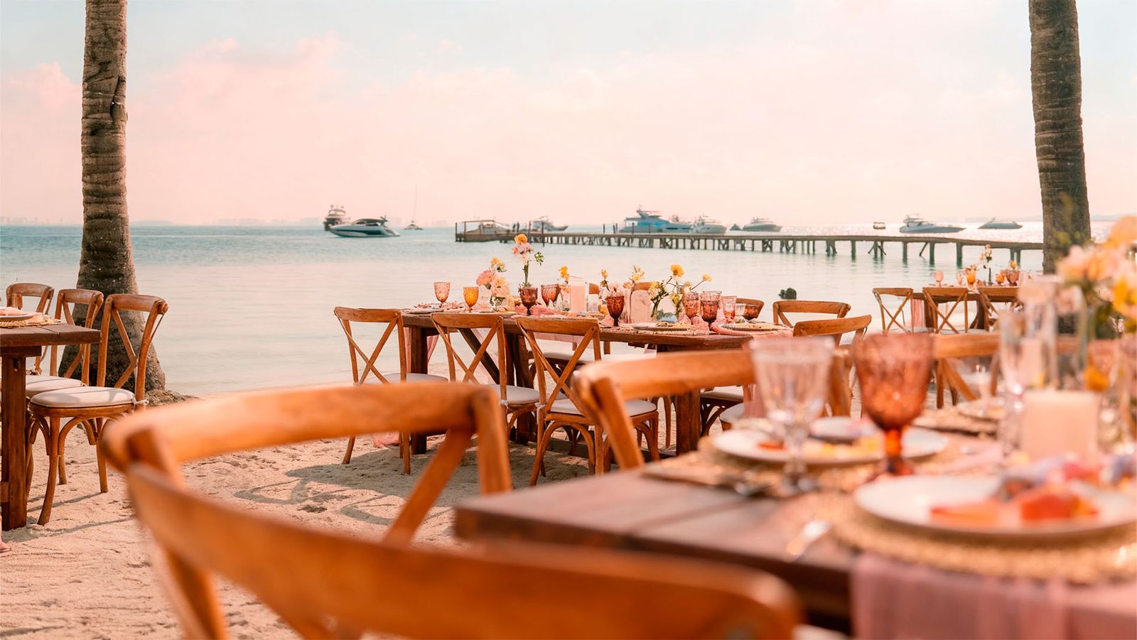 Dinner tables set on the sand