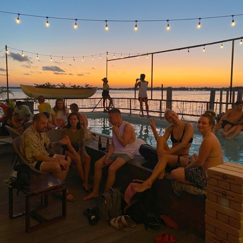 Sunset pool party on the rooftop deck at Mayan Monkey