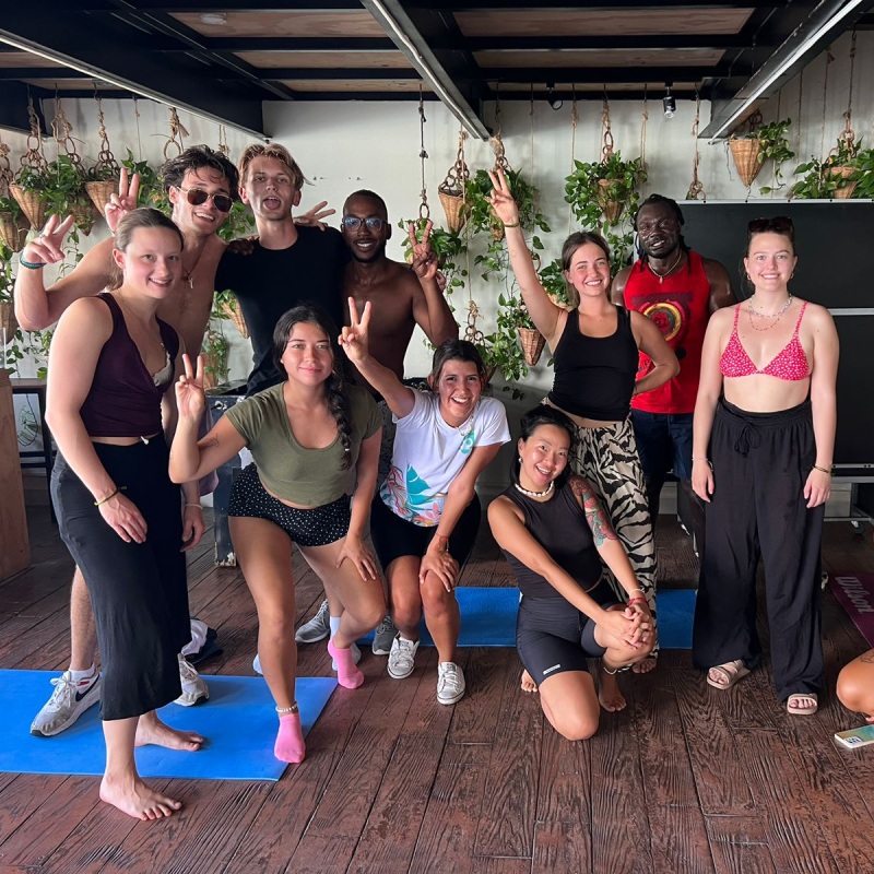 Group yoga class at a Mayan Monkey social hotel