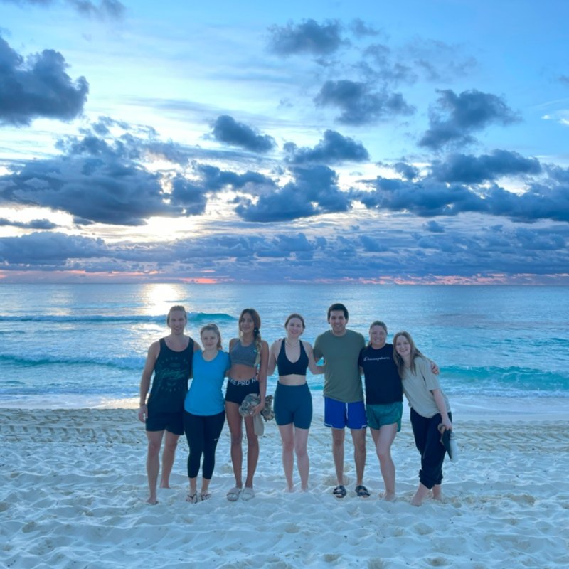 Mayan Monkey group photo on the beach at sunrise