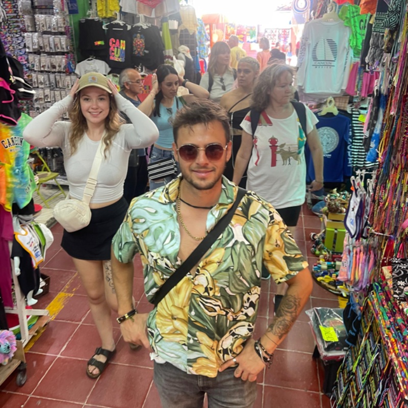 Guests shopping for souvenirs on a Mayan Monkey market tour