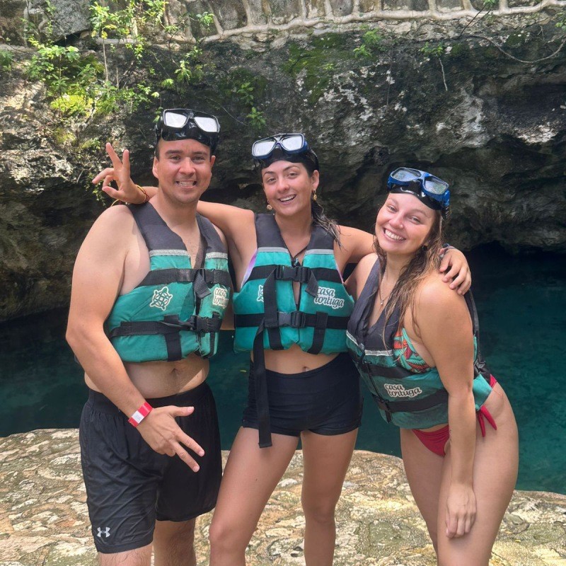 Snorkeling group in a cenote cave with Mayan Monkey