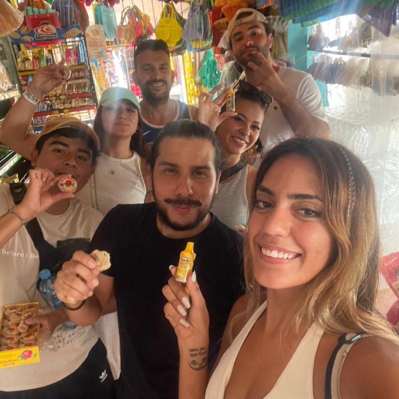 Guests tasting local snacks at a Mexican market with Mayan Monkey